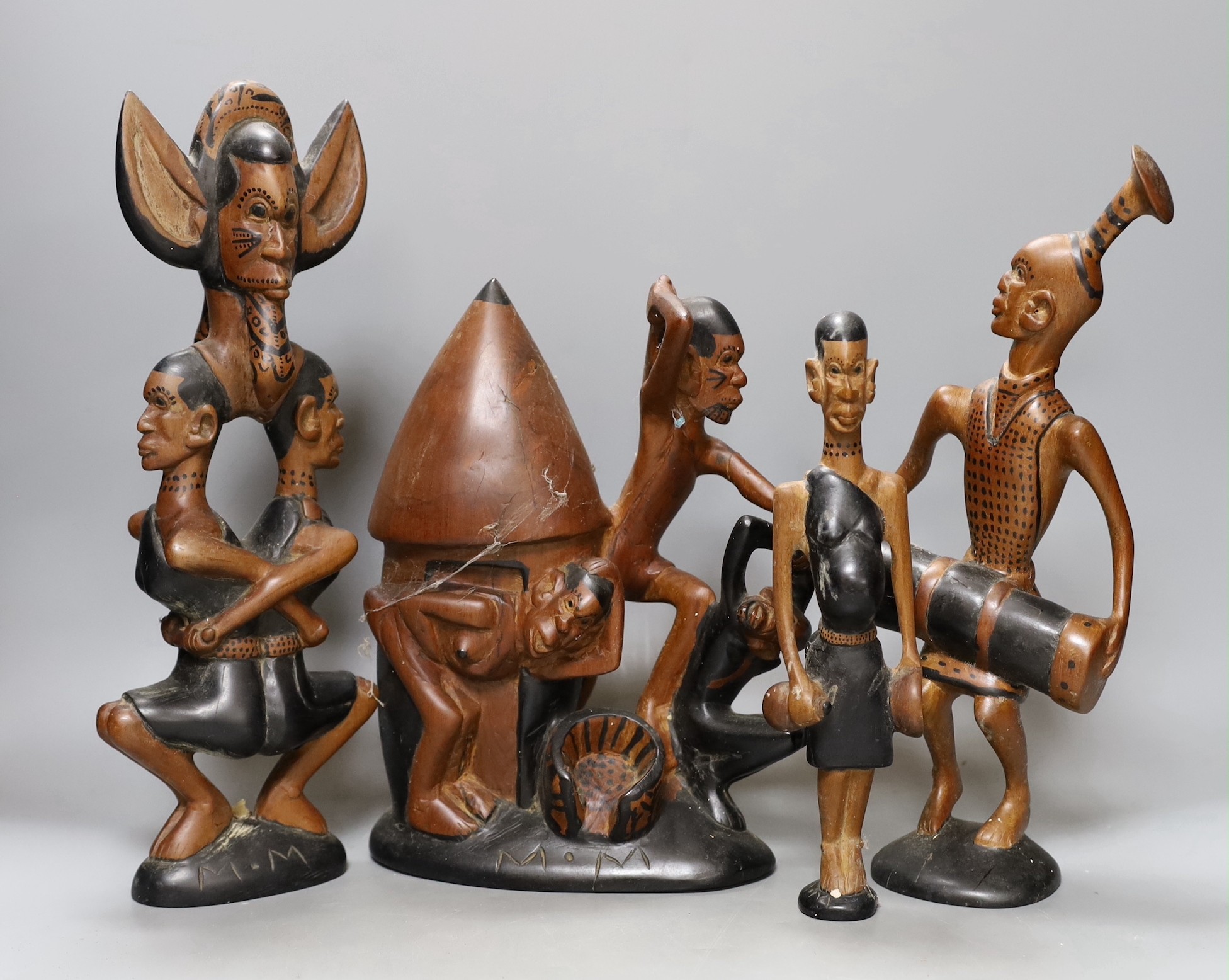 A narrative set of African wooden carvings, 35cm